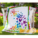 The beautiful Blooming Butterflies quilt draped over a chair outside | Shabby Fabrics
