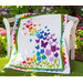The beautiful Blooming Butterflies quilt draped over a chair outside