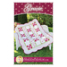 The front of the Gracie quilt pattern by Shabby Fabrics showing the finished quilt with a scalloped border.