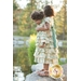 An image of a little girl & her doll wearing the Dolly & Me Petticoat Dresses.