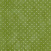 mottled green fabric with tiny cream polka dots