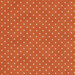 Fabric features tiny cream polka dots on mottled dark orange | Shabby Fabrics
