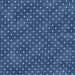 mottled light navy blue fabric with tiny cream polka dots