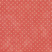 Fabric featuring tiny cream polka dots on mottled pink