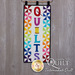 Quilts Wall Hanging with two rows of pinwheels in a rainbow of colors. Appliqued text reads Quilts.