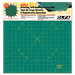 Green Olfa rotary cutting mat with a grid and a 12-inch ruler marked along the bottom edge