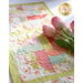 table runner in the sunshine with a bunch of tulips