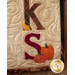 A close up of applique letters in the A Year In Words Wall Hanging - November