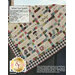 Back cover of the Hometown Christmas quilt kit pattern with a photo of the finished quilt and project specifications