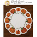Top down view of the scalloped white wool mat with pumpkins all around the border