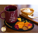 The November Wooly Mug Mat displayed with a cup of cocoa and slice of pie!