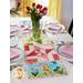The adorable March Easy Pieced Table Runner displayed on a set table
