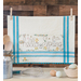 A vintage style dish towel with hand embroidered floral motifs with bunnies and the words 