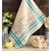 A vintage style dish towel with hand embroidered floral motifs with bunnies and the words 