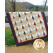 The Daddy's Ties quilt draped over a fence outdoors | Shabby Fabrics
