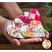 A variety of patchwork heart pocket prayers being held in hands | Shabby Fabrics