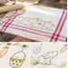 Photo collage of images of a vintage style dish towel with hand embroidered bunnies and Easter motifs laying on a kitchen counter with a rolling pin and kitchen utensils.