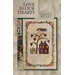 The front of the Love In Our Hearts pattern by Art to Heart featuring a home surrounded by a cute heart tree