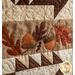 Applique acorns and maple leaves on the Harvest Blessings Wall Hanging
