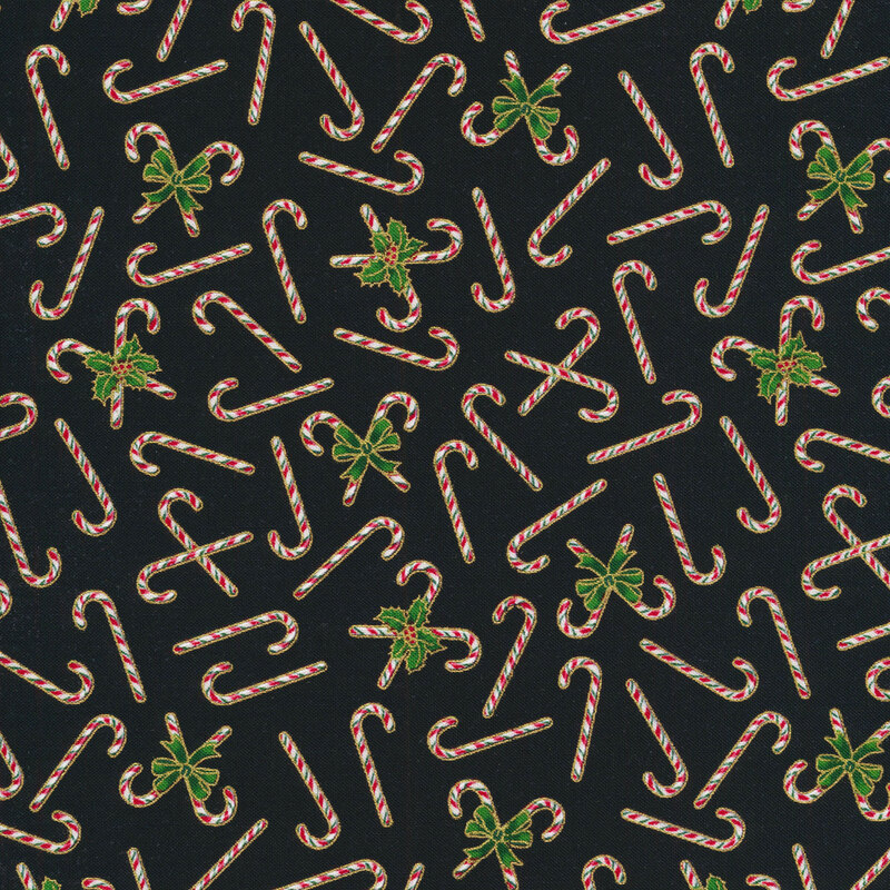 Fabric with tossed candy canes and gold metallic accents on a black background