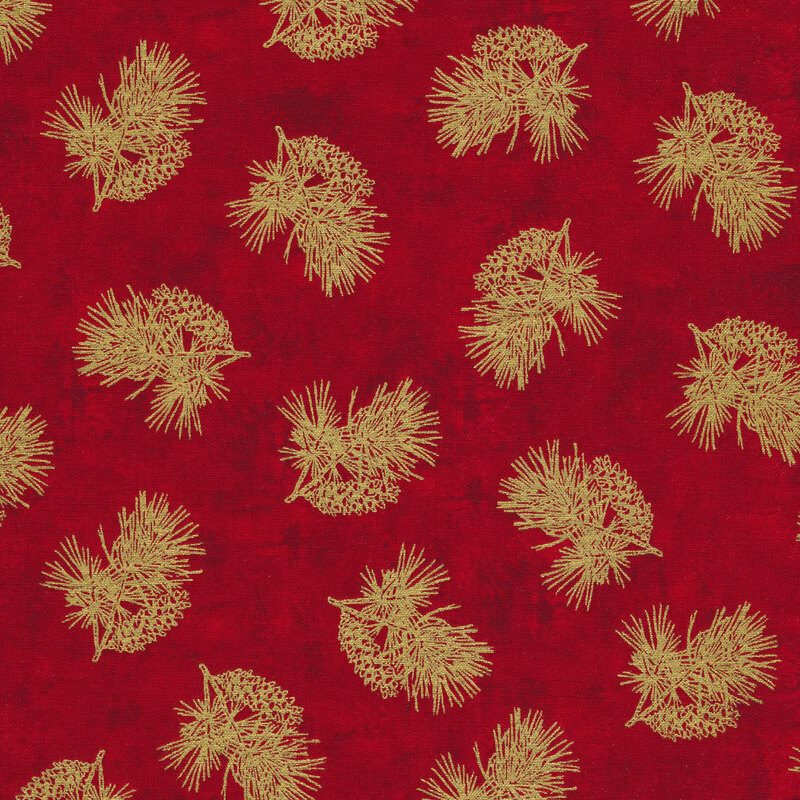 Tossed metallic evergreen and pine cones on a red background