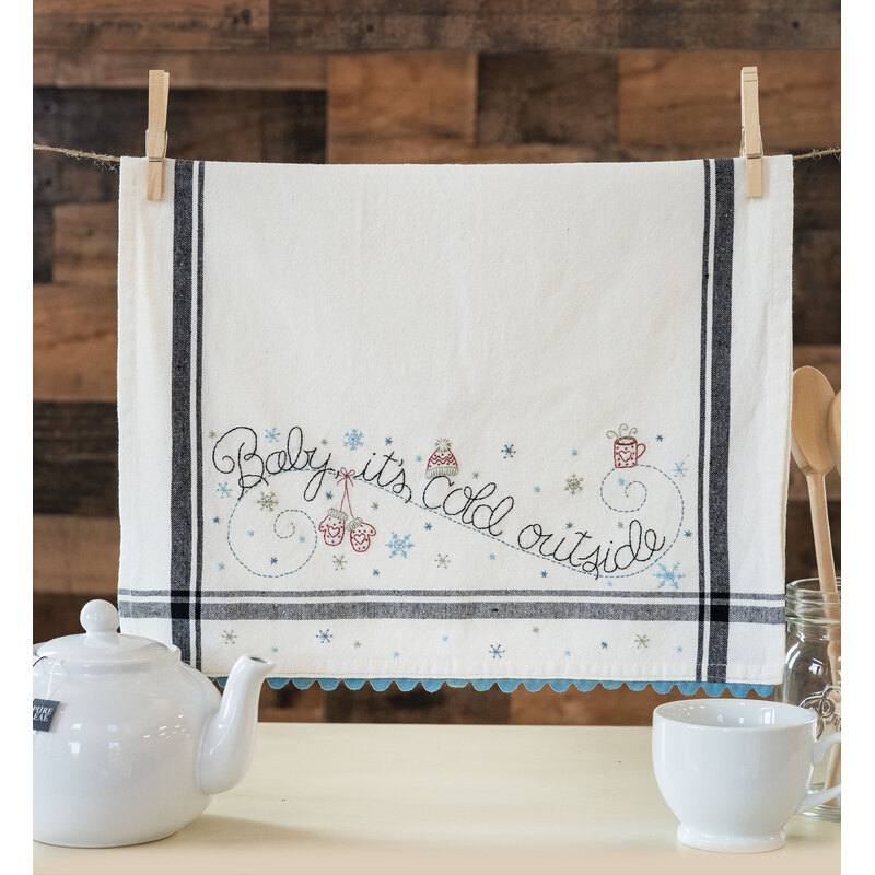 The January Vintage Kitchen Towel hanging from clothespins