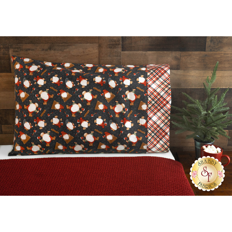 Flannel pillowcase with tossed gnomies on a bed