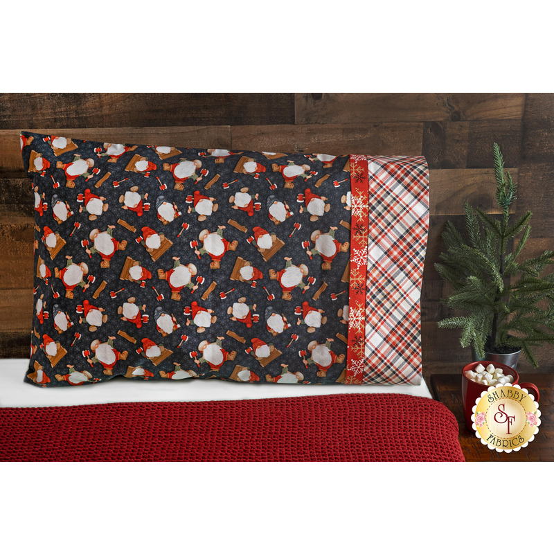 The gray Timber Gnomies pillowcase on a bed