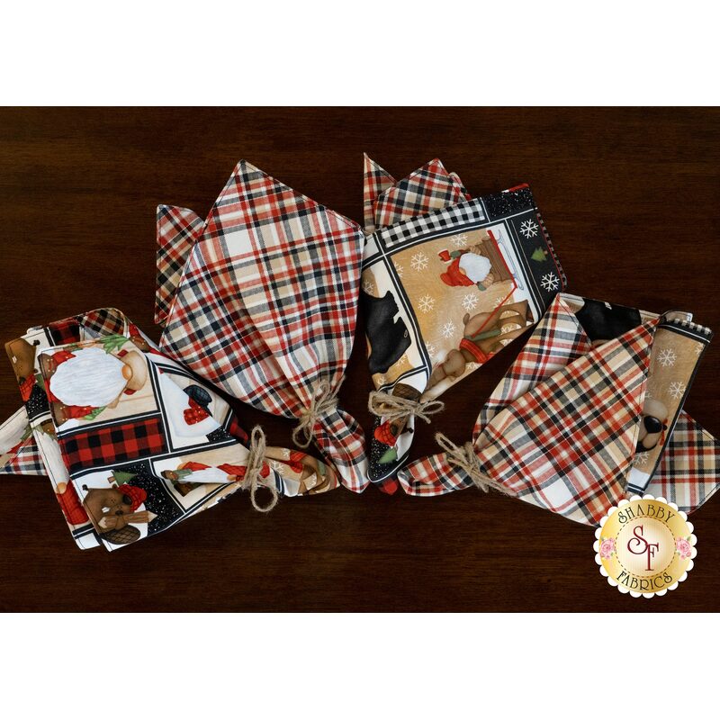 Timber Gnomies cloth napkins displayed on a wood table