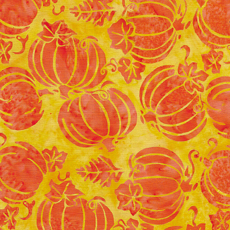 Tossed orange pumpkins on a yellow background