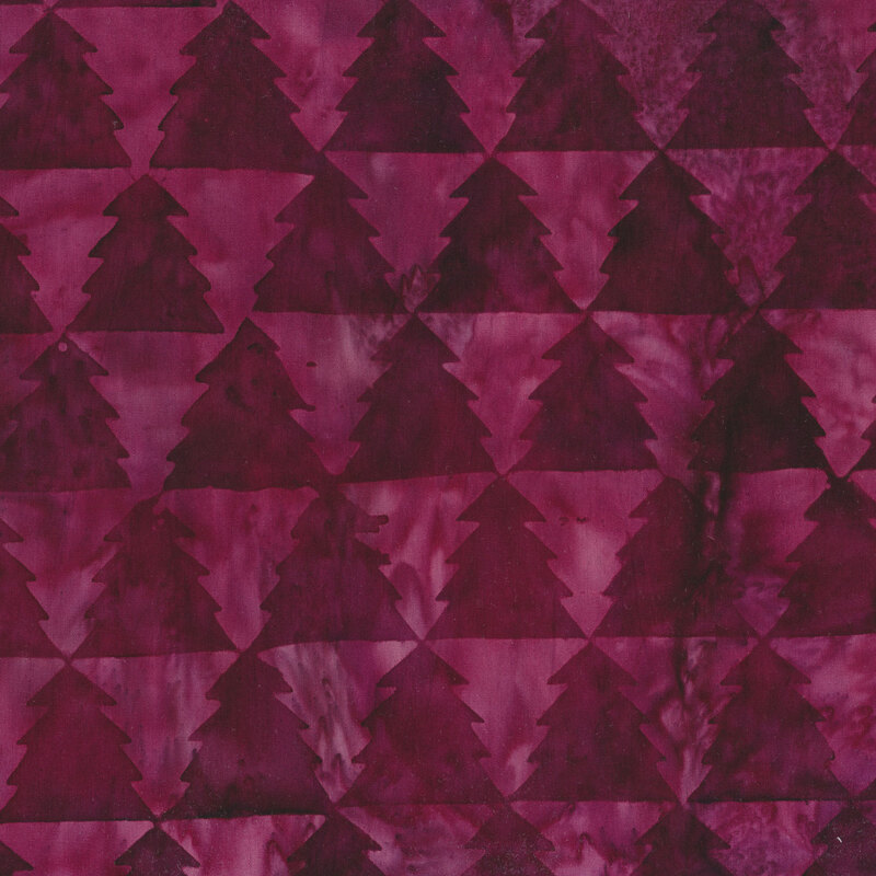 Purple mottled batik fabric with alternating light and dark connected pine trees