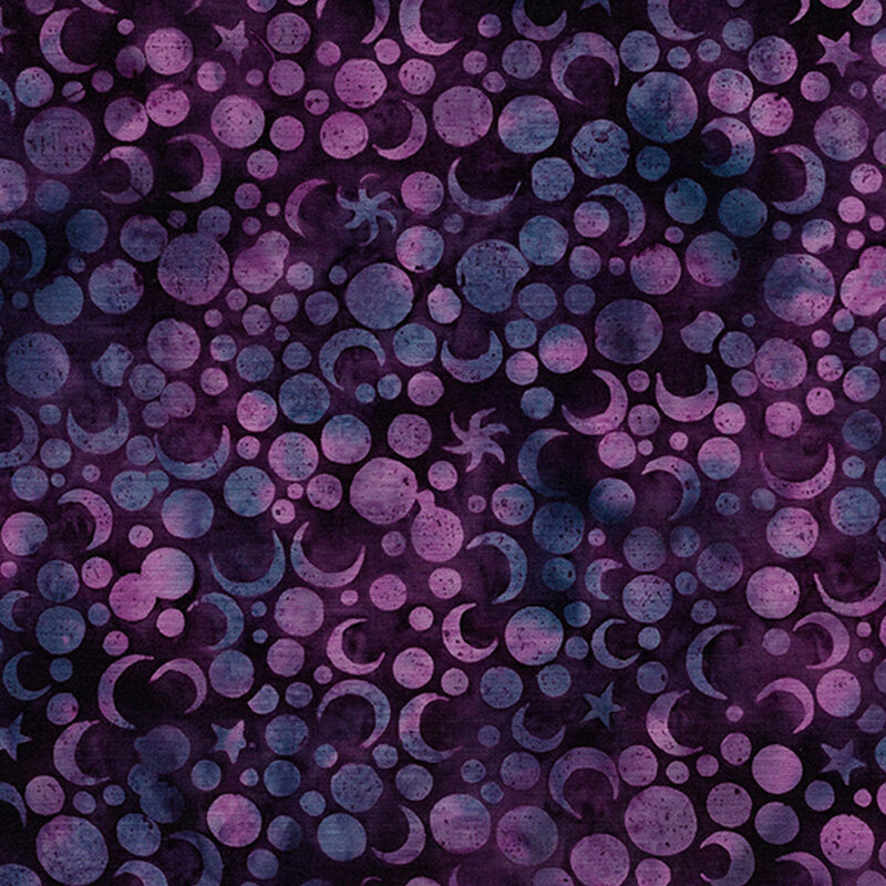Mottled moons and stars on a dark purple background