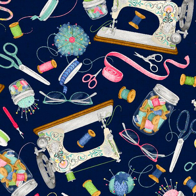 Sewing supplies tossed all over a blue background