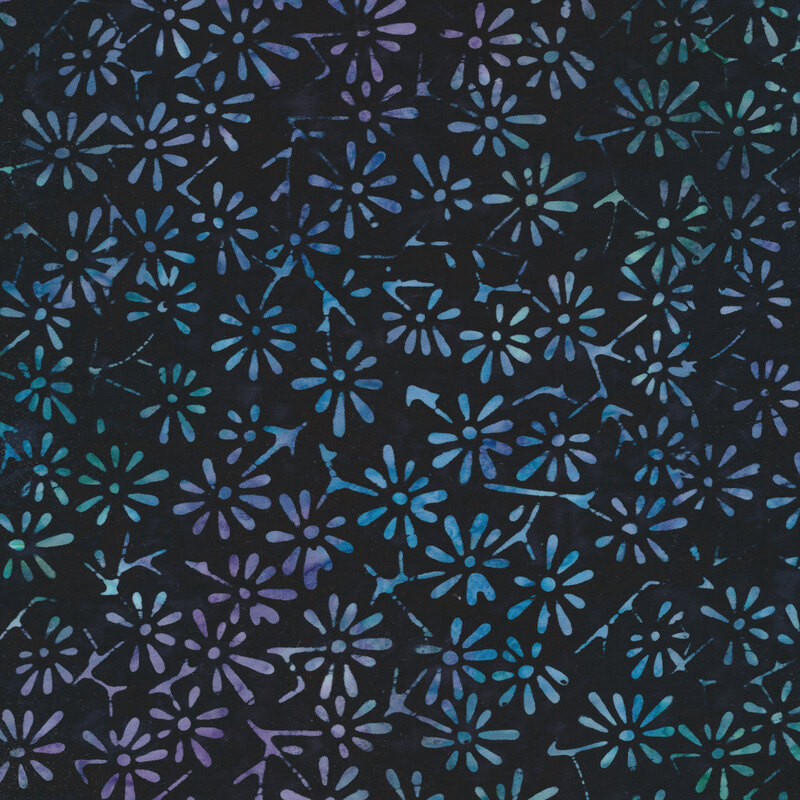 Tossed flower designs on a mottled blue background