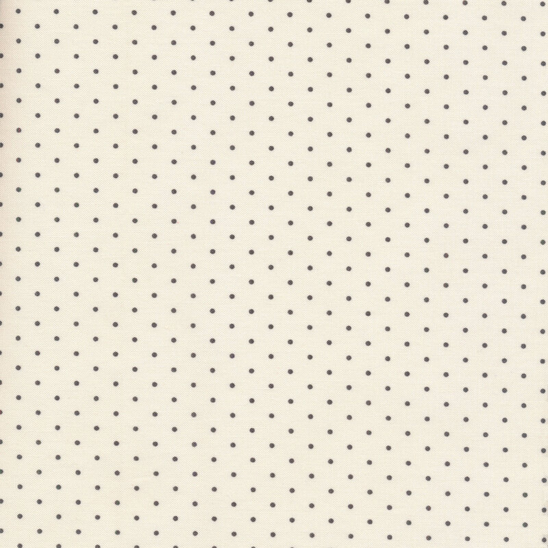 Black polka dots on a cream background