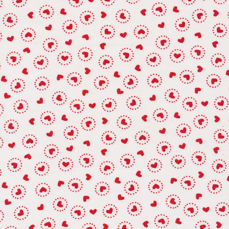 Small red tossed hearts all over a white background
