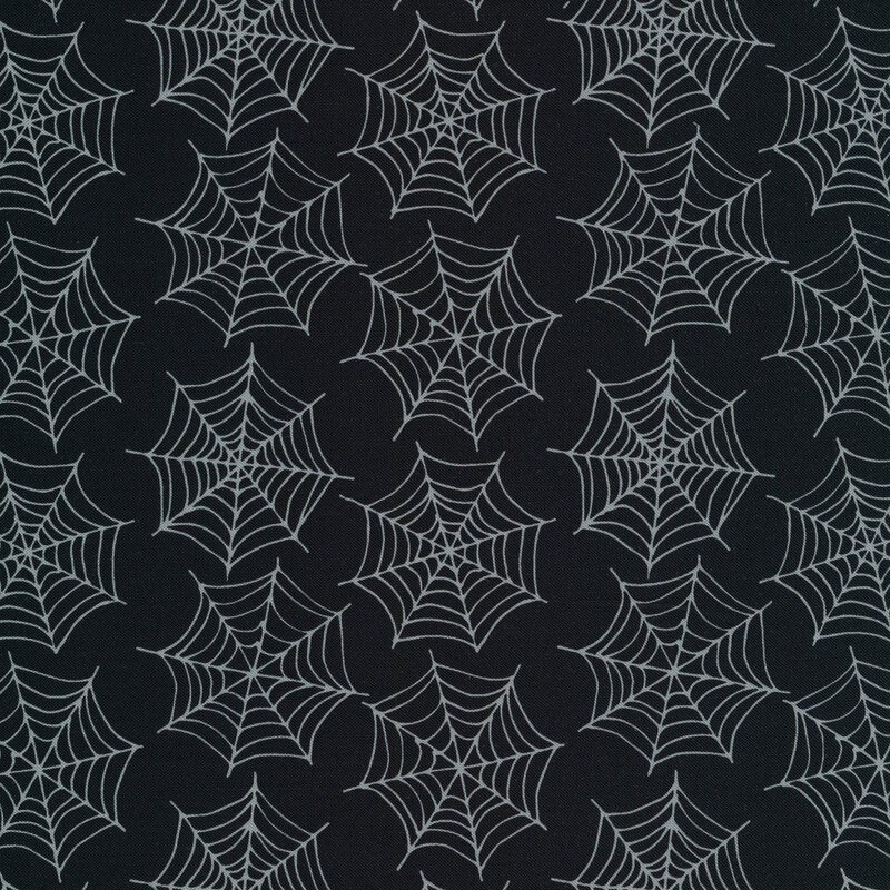 Spiderwebs on a black background