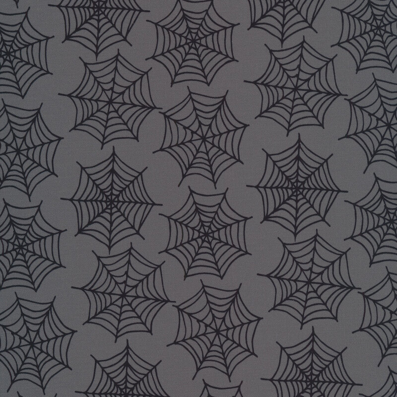 Spiderwebs on a gray background