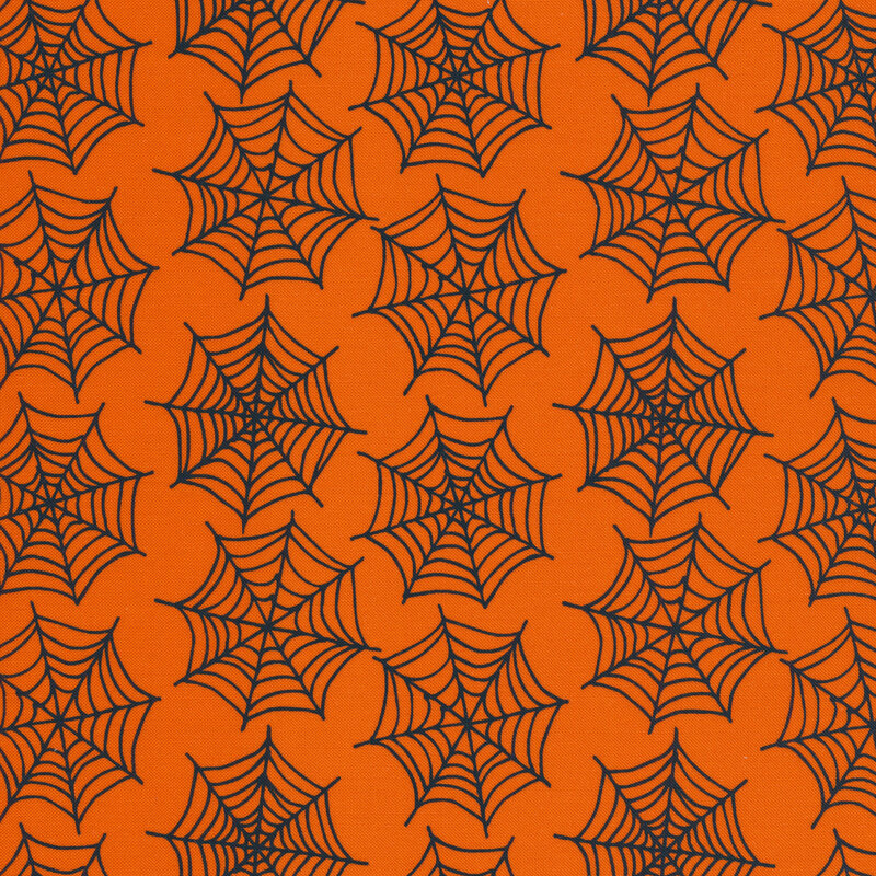 Spiderwebs on an orange background