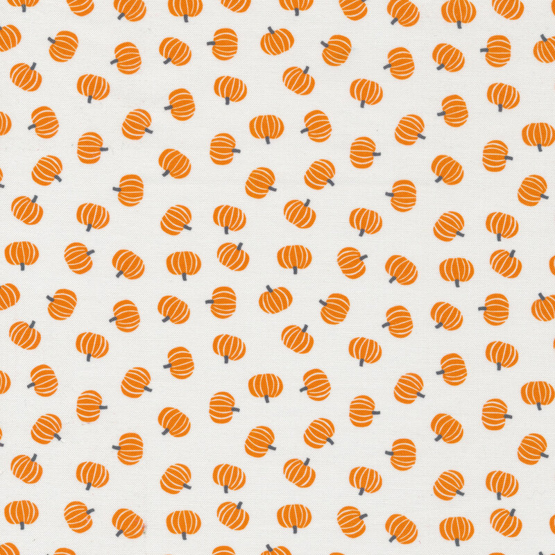 Tossed orange pumpkins on a white background