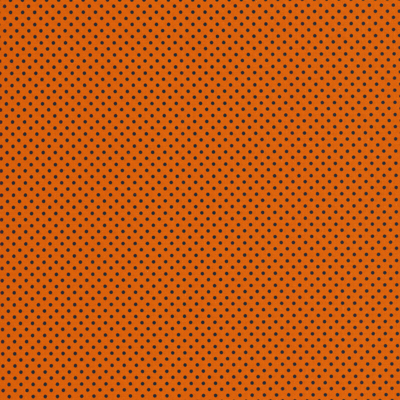 Black polka dots on an orange background