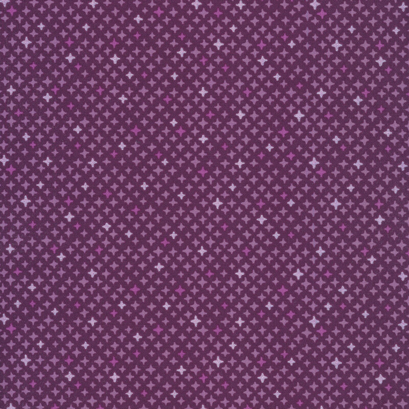 Metallic and purple star designs on a dark purple background