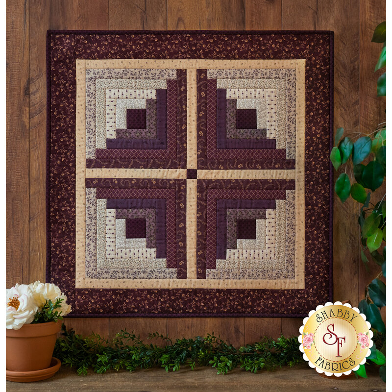 The beautiful Log Cabin Wall Hanging Kit made with the lovely Plumberry fabrics