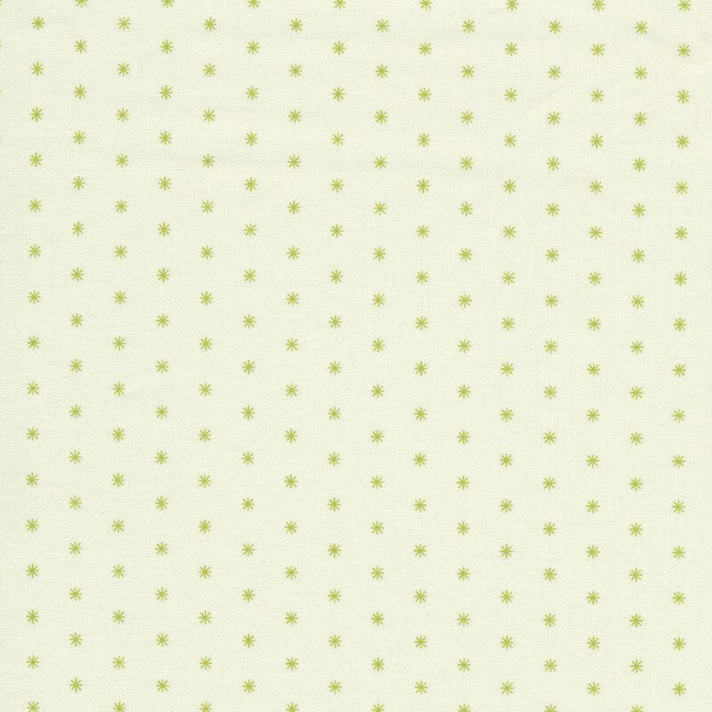 Cream fabric features tiny green snowflake print pattern | Shabby Fabrics