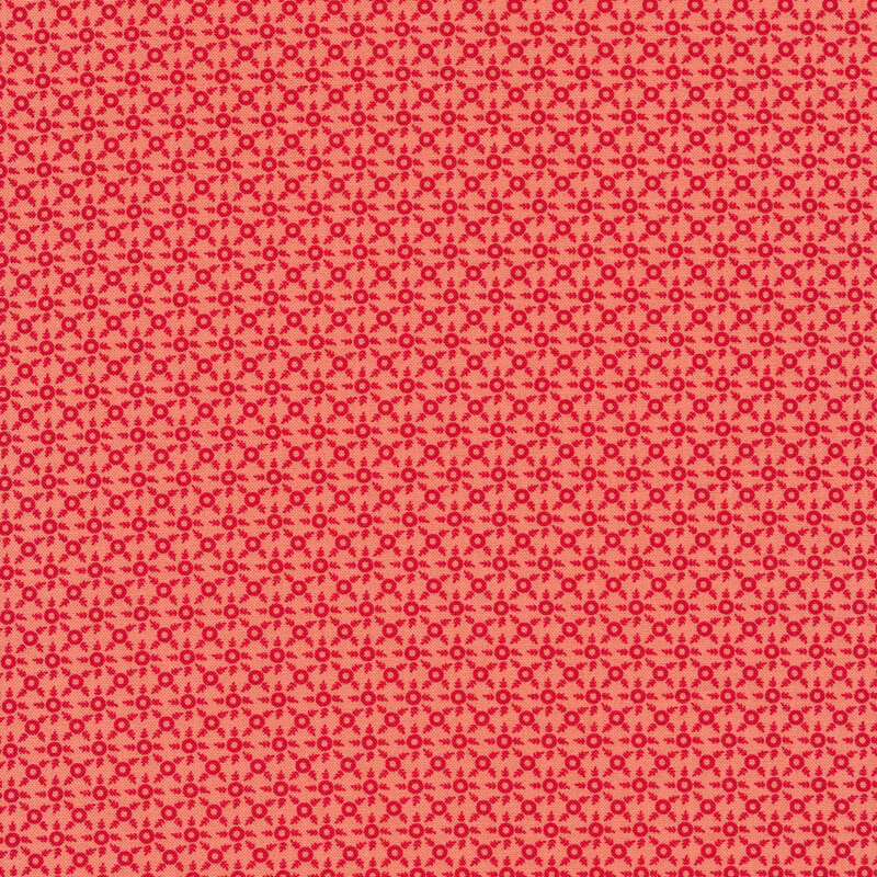 Red ditsy print on a pink background