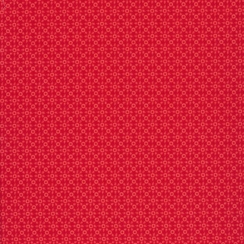 Pink ditsy print on a red background