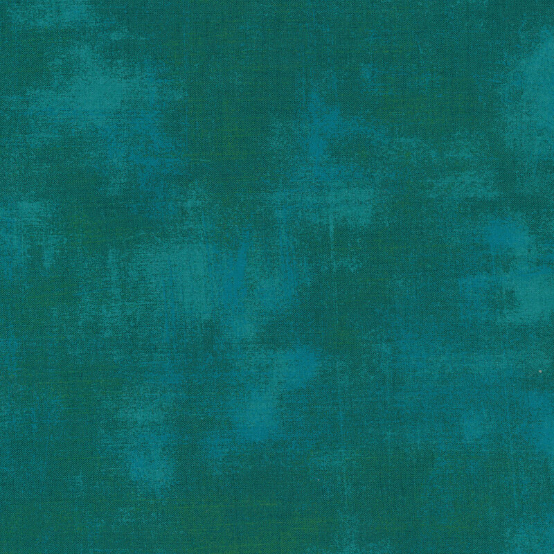 Teal and green grunge textured fabric