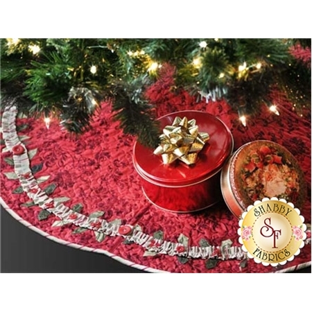 Red tree skirt with holly border and buttons.