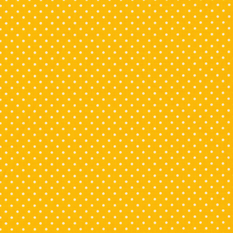 Yellow fabric with little white polka dots