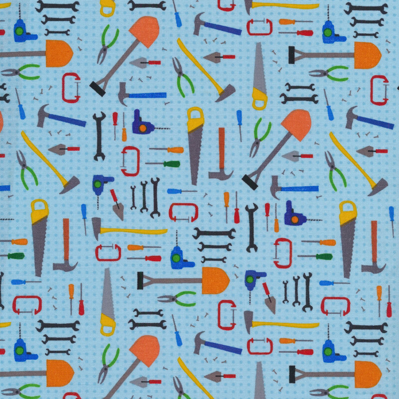 Tossed tools on a tonal light blue dotted background